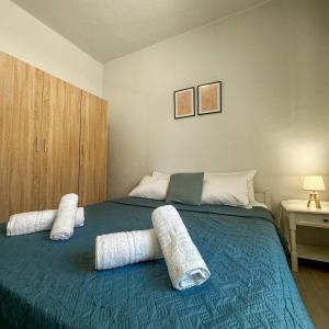 a bedroom with a bed with two pillows on it at Alios apartment in Rhodes Town