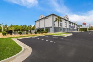 an empty parking lot in front of a building at Spark By Hilton Tifton in Tifton