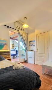 a bedroom with a bed and a door to a bathroom at Selwo Studio in Estepona