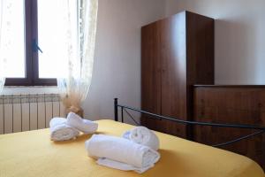 Giường trong phòng chung tại Residence Villarcangelo