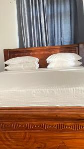 Voodi või voodid majutusasutuse PM Lodge and Restaurant toas