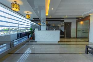 a lobby of a building with a reception desk in it at Hotel Fun City (Best Review Hotel In Navsari) in Navsāri