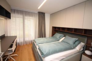 Postel nebo postele na pokoji v ubytování Viganello Luxury