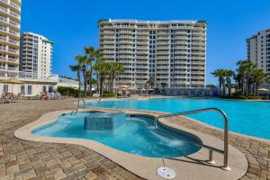 a swimming pool in front of a large apartment building at St. Lucia 1103 in Destin