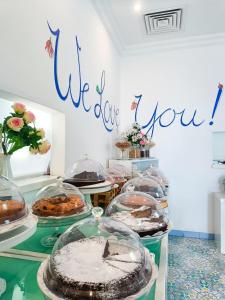 a table with many different types of cakes and pastries at Relais Maresca Luxury Small Hotel & Terrace Restaurant in Capri