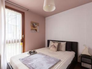 Кровать или кровати в номере Appartement Saint-Lary-Soulan, 2 pièces, 4 personnes - FR-1-296-288