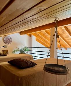 a bedroom with two beds and a wooden ceiling at Herdade Monte Do Sol in Aljezur