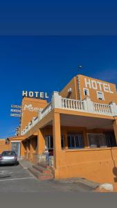 a hotel with a car parked in front of it at HOTEL MIRAMAR in Torreblanca