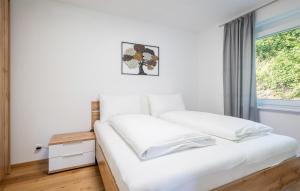 Postel nebo postele na pokoji v ubytování Seeblick-Apartment In Velden + 8 fotografií