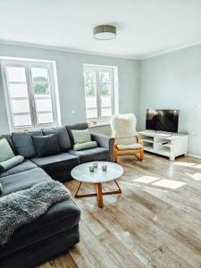 Posezení v ubytování *groot* Ferienwohnungen lütt & groot + 26 fotografií