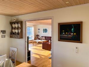 a view of a living room with a painting on the wall at Sea & Mountain View 3 Bedroom in Leynar