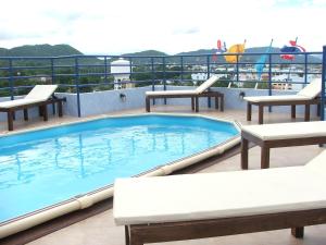 a swimming pool on the deck of a cruise ship at Hua Hin Loft in Hua Hin
