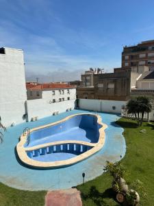 a large swimming pool on the side of a building at HOTEL MIRAMAR in Torreblanca
