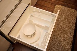a glass table with a plate on top of it at Casa YONNA Naha in Naha +40 photos