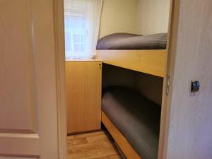 Katil dua tingkat atau katil-katil dua tingkat dalam bilik di Chalet 'De Bosrand'
