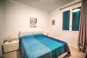 Posteľ alebo postele v izbe v ubytovaní Villa Lucia Riviera dei Fiori Pool - Happy Rentals + 31 fotografií