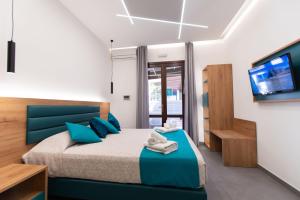 Room & Breakfast Aloe客房内的一张或多张床位