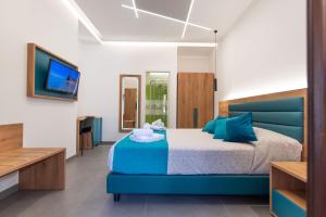 Room & Breakfast Aloe客房内的一张或多张床位