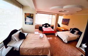 Postel nebo postele na pokoji v ubytování Hotel Xilon Resort Plaza + 10 fotografií