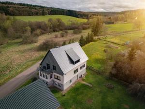 an overhead view of a white house in a field at Haus Meerten in Neroth