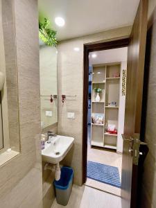 a bathroom with a sink and a shower at City Nest 1 BHK in Hiranandani Powai (C) in Mumbai