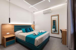 Room & Breakfast Aloe客房内的一张或多张床位