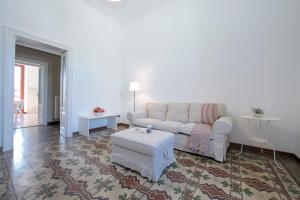 a living room with a couch and a coffee table at Residenza Oleandro Lake View Luino Center in Luino