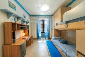 A bed or beds in a room at Il Mosaico Al Mare