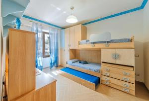 A bed or beds in a room at Il Mosaico Al Mare
