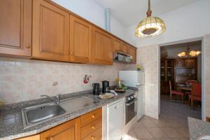 A kitchen or kitchenette at Casa Amabile With Salty water Pool - Happy Rentals