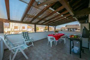 A balcony or terrace at Casa Amabile With Salty water Pool - Happy Rentals