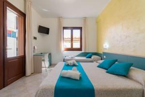 Room & Breakfast Aloe客房内的一张或多张床位
