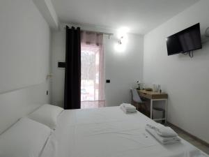 Postel nebo postele na pokoji v ubytování Zenia Rooms