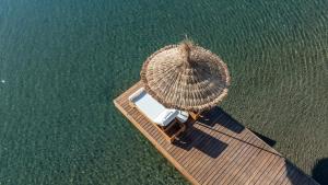 an overhead view of a dock with a large straw boat at Prime Beach Hotel Ex Ideal Prime Beach in Marmaris