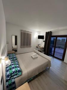 Postel nebo postele na pokoji v ubytování Zenia Rooms