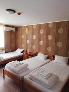 מיטה או מיטות בחדר ב-Комплекс Рожена, хотел, хотелски комплекс Рожена