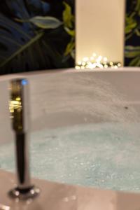 a close up of a tub filled with water at Suite Home3 beb in Bisceglie