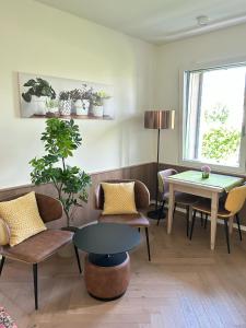 a living room with chairs and a table at Ca' Barbieri San Donà in San Donà di Piave