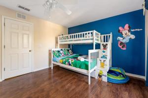 a childs bedroom with a mickey mouse bunk bed at Resort w Lazy River and Arcade 30mis to Disney in Davenport