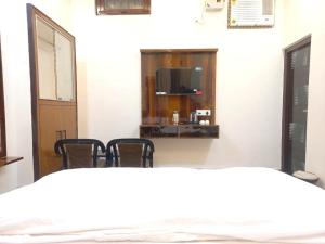 Postel nebo postele na pokoji v ubytování Kalash Guest House