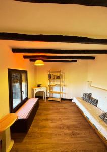 a room with two beds and a desk in it at Cal Xeco en Montsonis, da la bienvenida a tu mascota in Montsonis