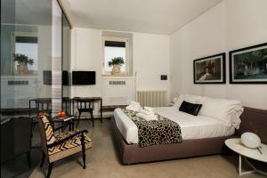 Televízia a/alebo spoločenská miestnosť v ubytovaní Embrace Sicily Guest House
