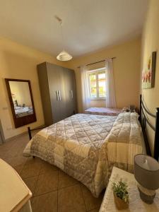 En eller flere senge i et værelse på Casa Olbia