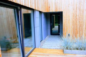 a building with sliding glass doors on it at Panorama Podlasie Home&SPA in Czyże