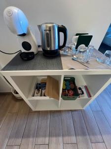 a table with a coffee pot on top of it at Controvento in Casalbordino