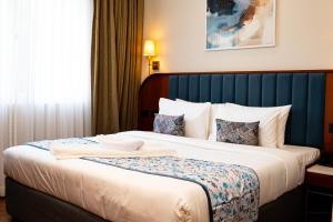 Posteľ alebo postele v izbe v ubytovaní HOTEL BENHUR