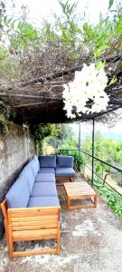 a living room with a couch and two tables at CASA TARTARUGA in La Spezia
