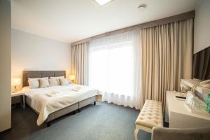 Posteľ alebo postele v izbe v ubytovaní Hotel i Apartamenty pod Śnieżnikiem