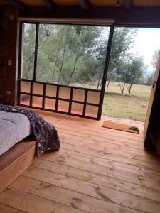 Postel nebo postele na pokoji v ubytování Hotel Rokas de Suesca