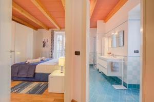 Ένα ή περισσότερα κρεβάτια σε δωμάτιο στο Concordia Apartment Laveno - Happy Rentals